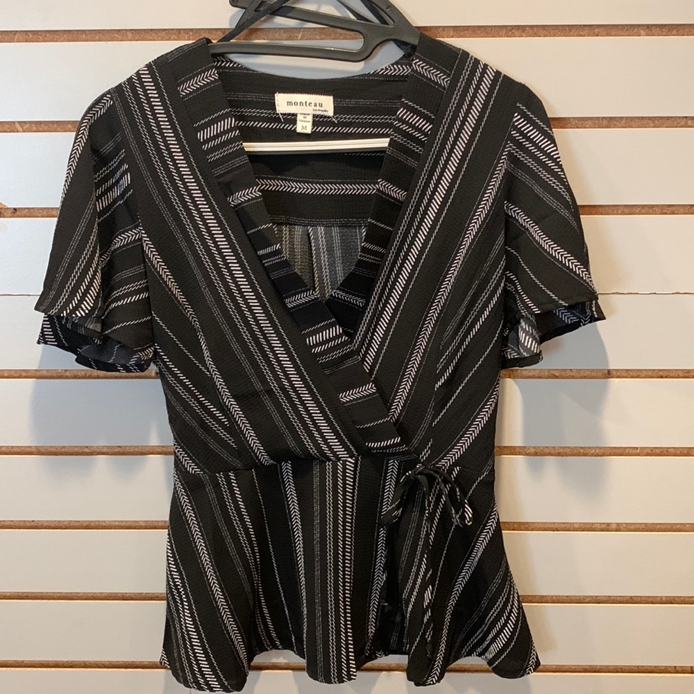 Women’s size M black & white shirt. Feminine styling. Perfect sleeve length!